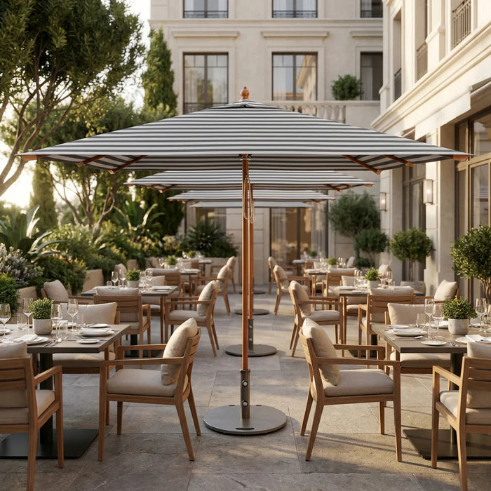 Row of Midtown Bamboo umbrellas on a hotel terrace by the sea