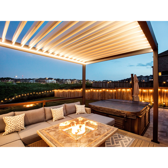 LOUSOL aluminum louvered pergola with integrated LED lighting over an outdoor lounge